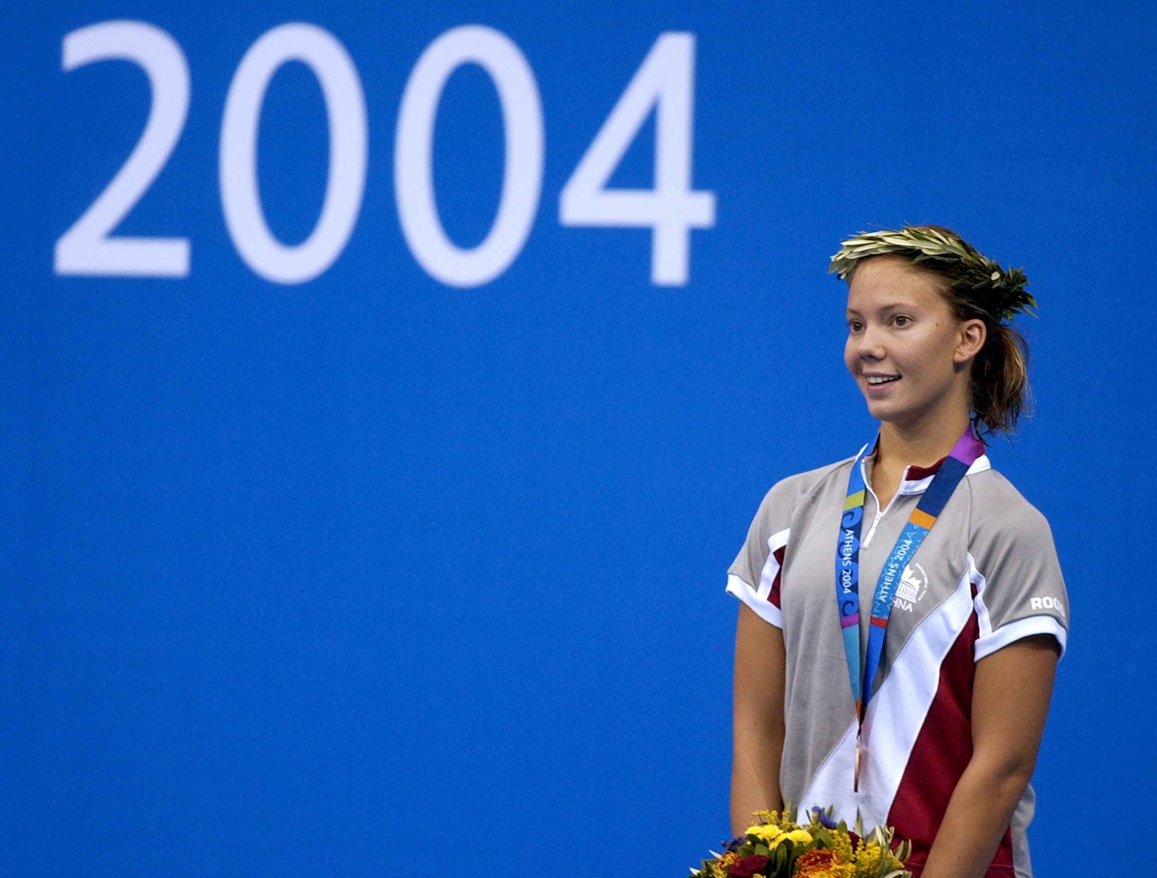 Danielle Campo standing on the podium at the Athens 2004 Paralympic Games. 