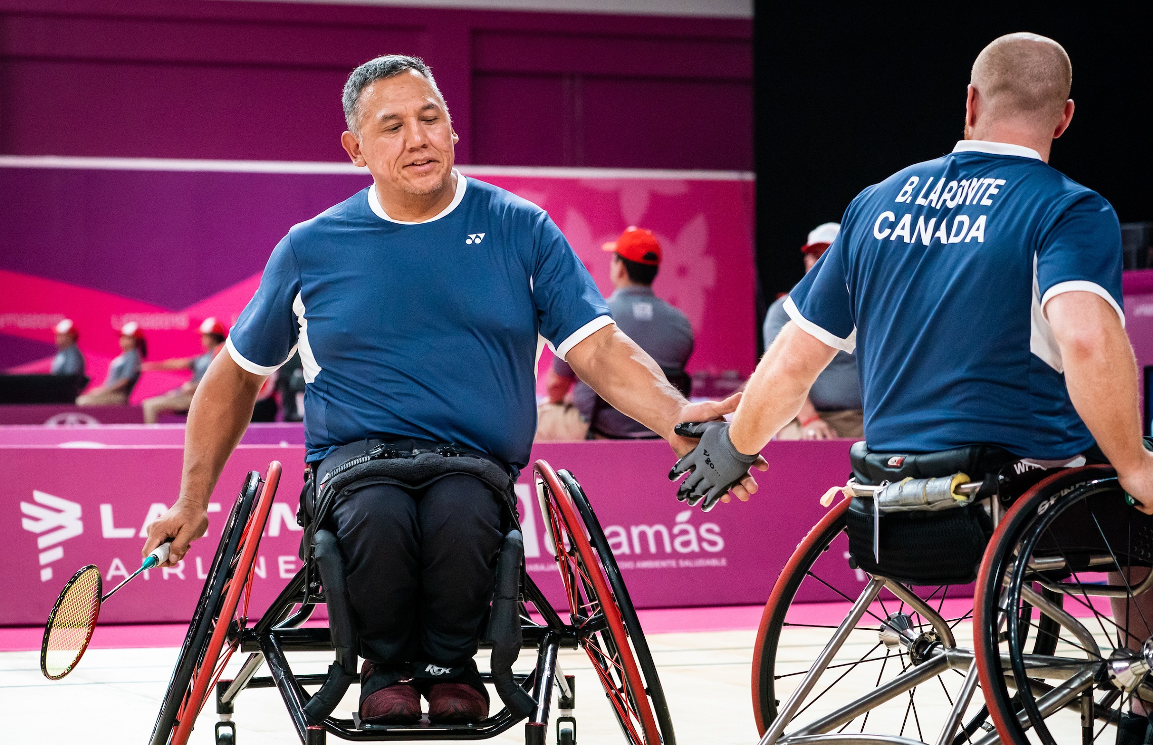 Richard Peter shaking hands with his Para badminton teammate Bernard Lapointe at the Lima 2019 Parapan Am Games