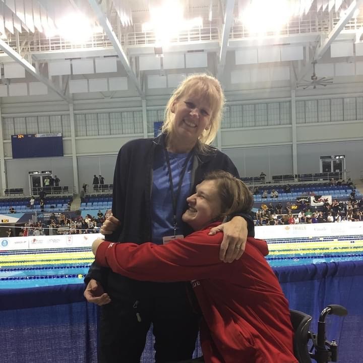 Nikita Ens hugging her mom Monica at a swim meet