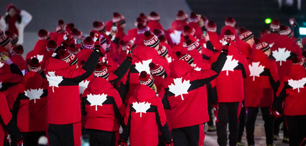 Opening ceremony shot of maple leafs on Canadian jackets