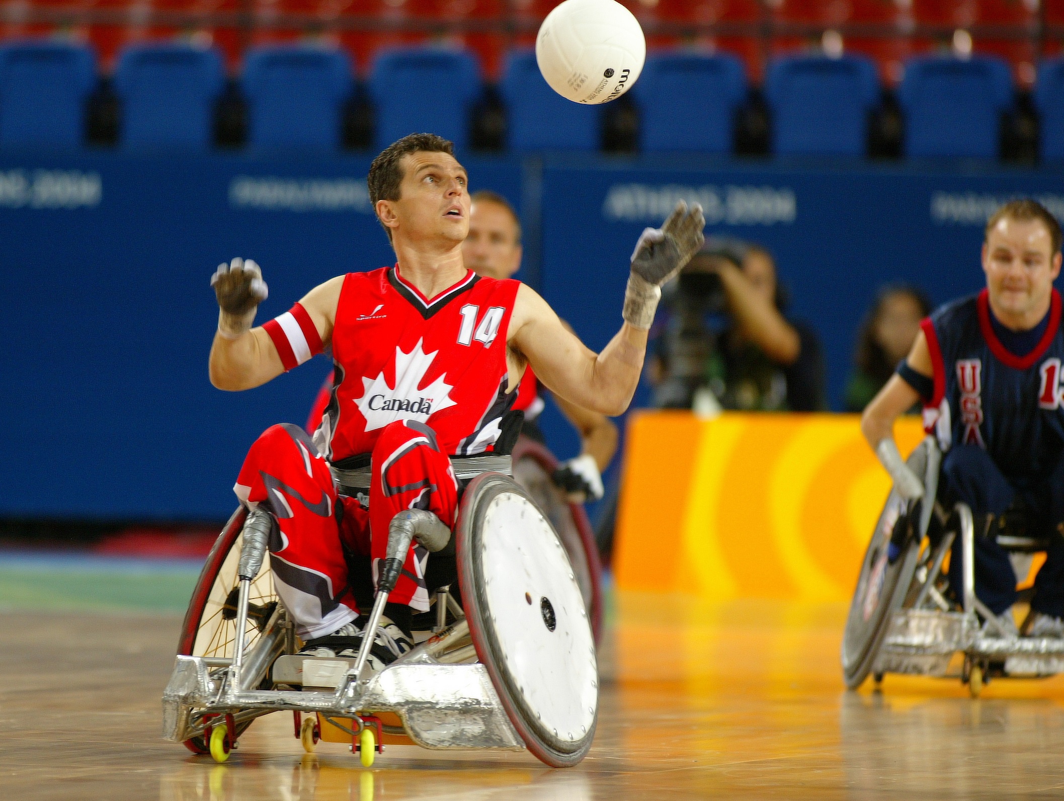 David Willsie in wheelchair rugby action about to catch the ball