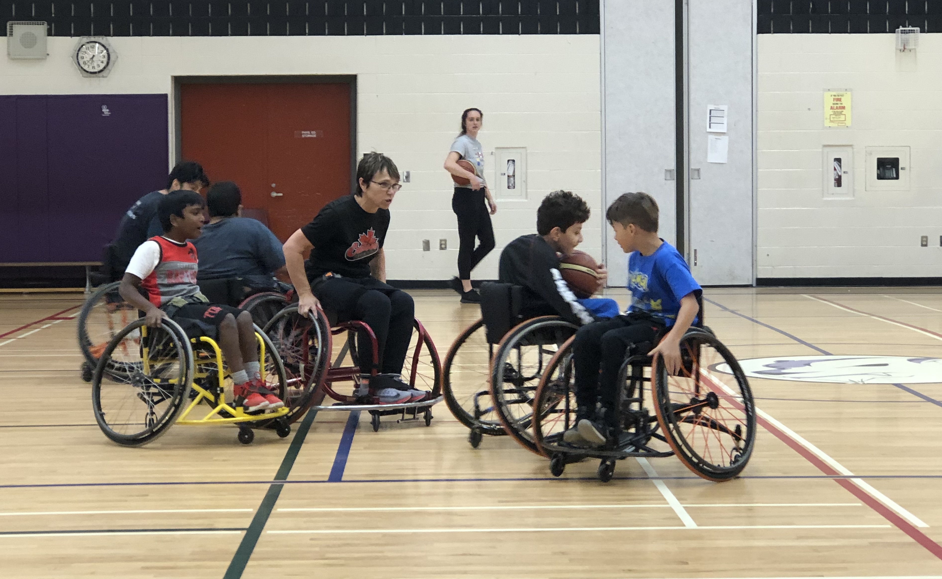 Cruisers Sports participants playing wheelchair basketball