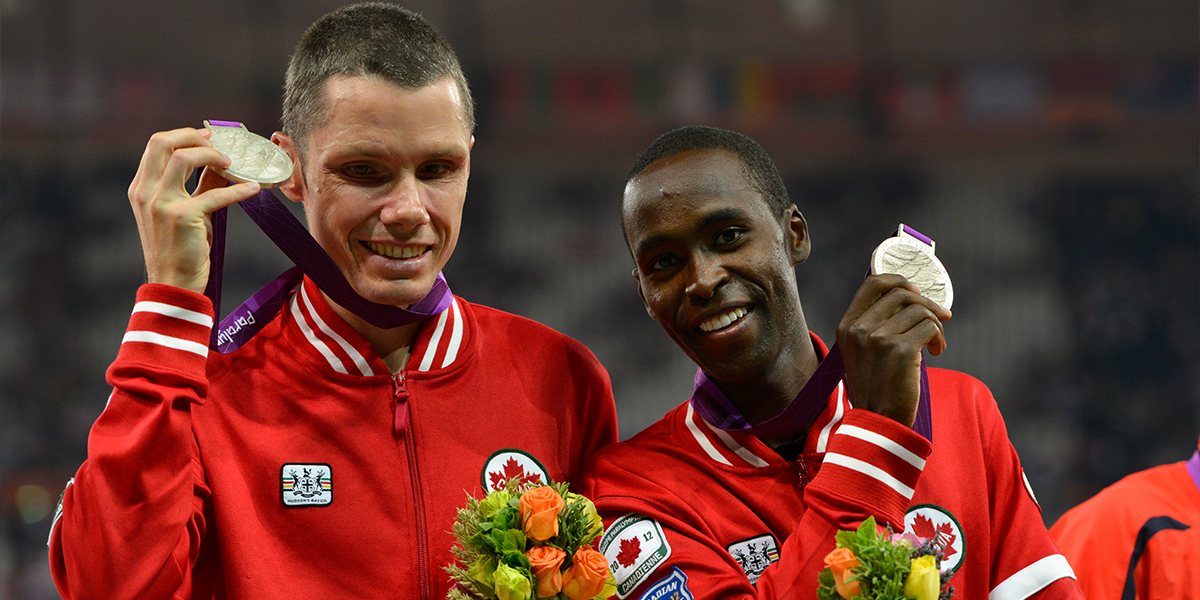 An image of visually impaired runner Jason Dunkerley, on the left, and his guide Josh Karanja, celebrating winning the silver medal at the London 2012 Paralympics.