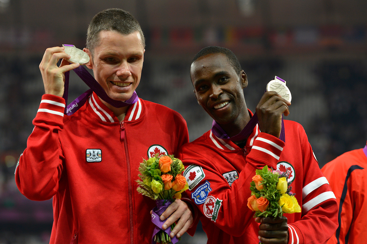 Jason Dunkerley and guide Josh Karanja with their silver medals from the 5000m at London 2012. 