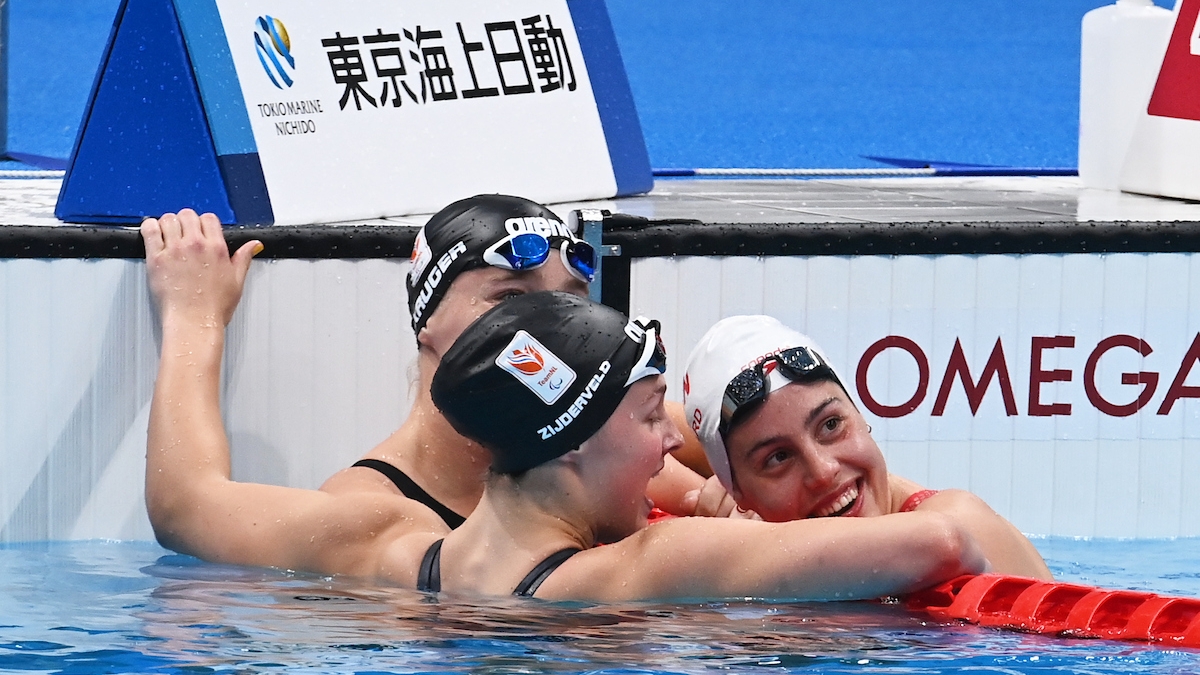 Aurelie celebrates in the pool after winning gold