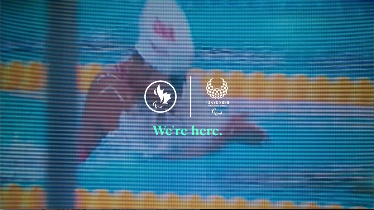 An image of Katarina Roxon in the pool, with the CPC and Tokyo 2020 logos and the text "We're Here" overlaid