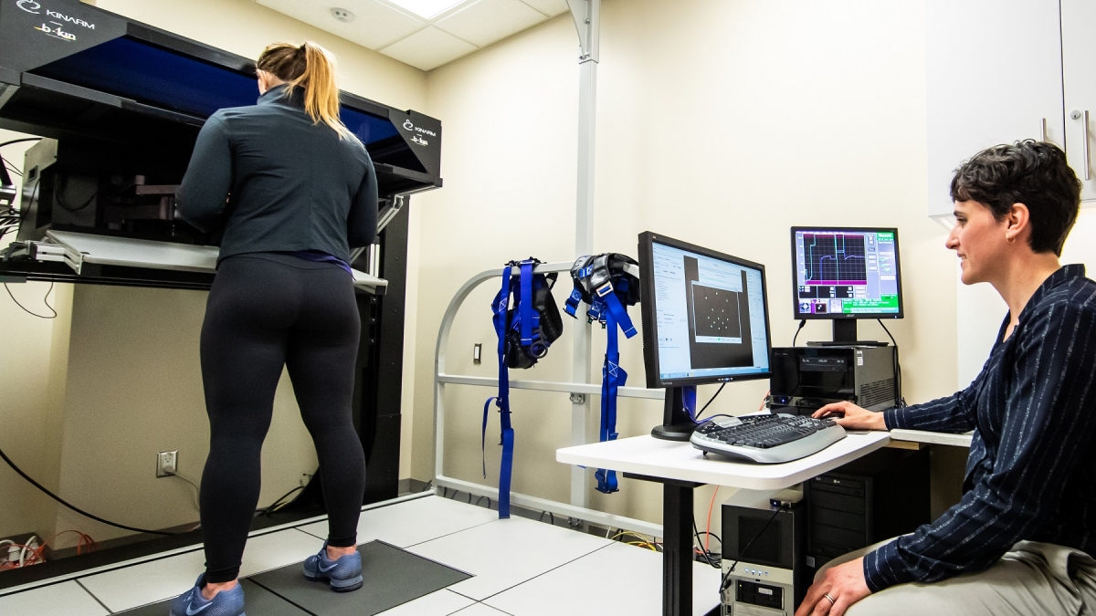 An athlete is tested on the KINARM robotic technology testing brain function.