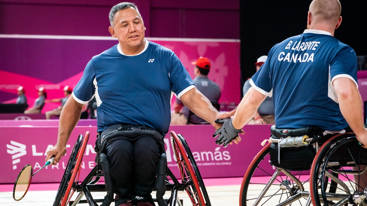 Richard Peter shaking hands with his Para badminton teammate Bernard Lapointe at the Lima 2019 Parapan Am Games
