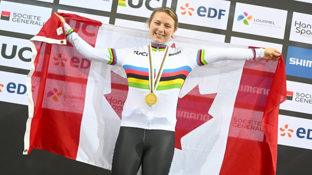 Mel Pemble holding the Canadian flag with her gold medal at the 2022 Para Cycling Track World Championships