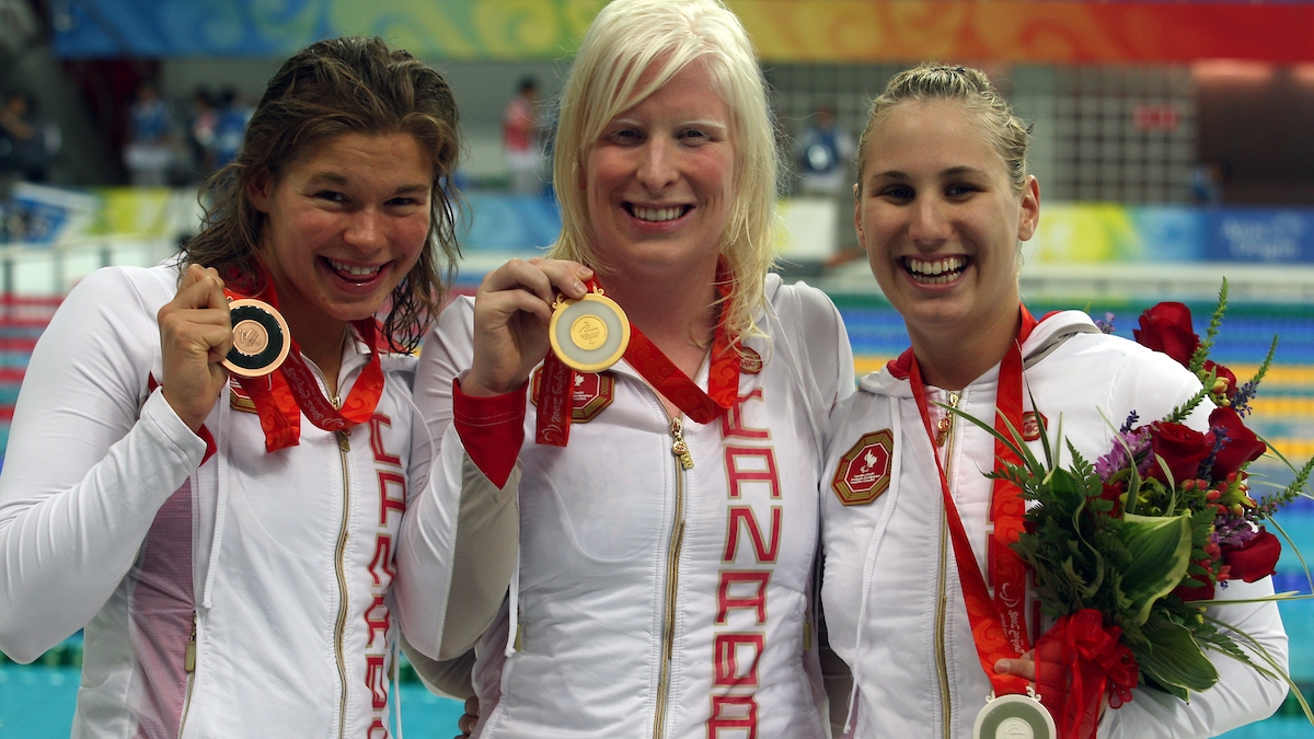 Chelsey Gotell (centre) with her gold medal, Valerie Grand'Maison and Kirby Cote after sweeping the podium in 200IM S13 at the 2008 Games