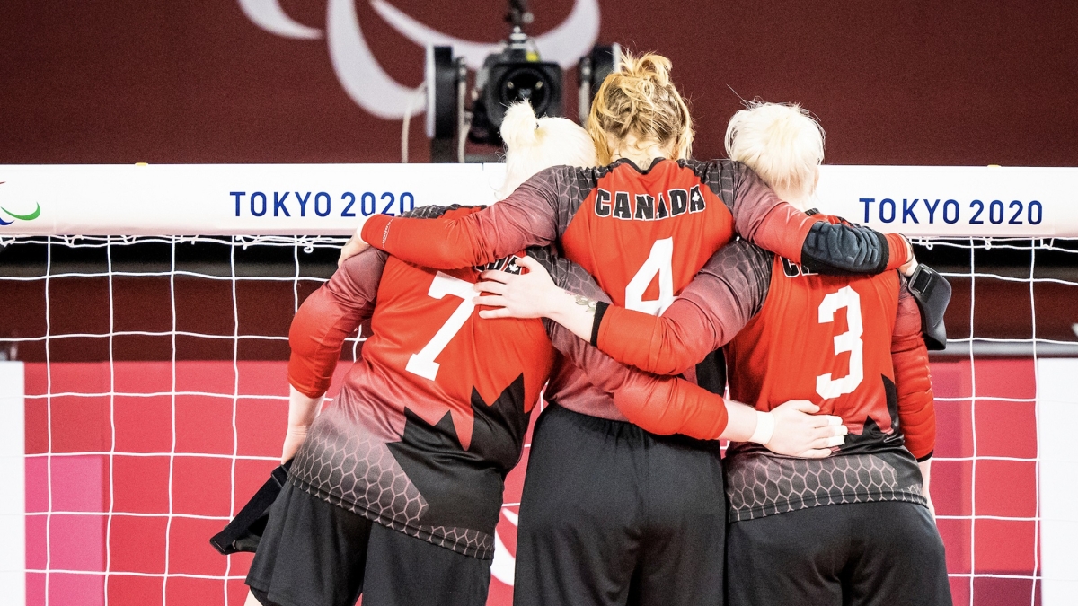 Canada's women's goalball team members with their arms around each other