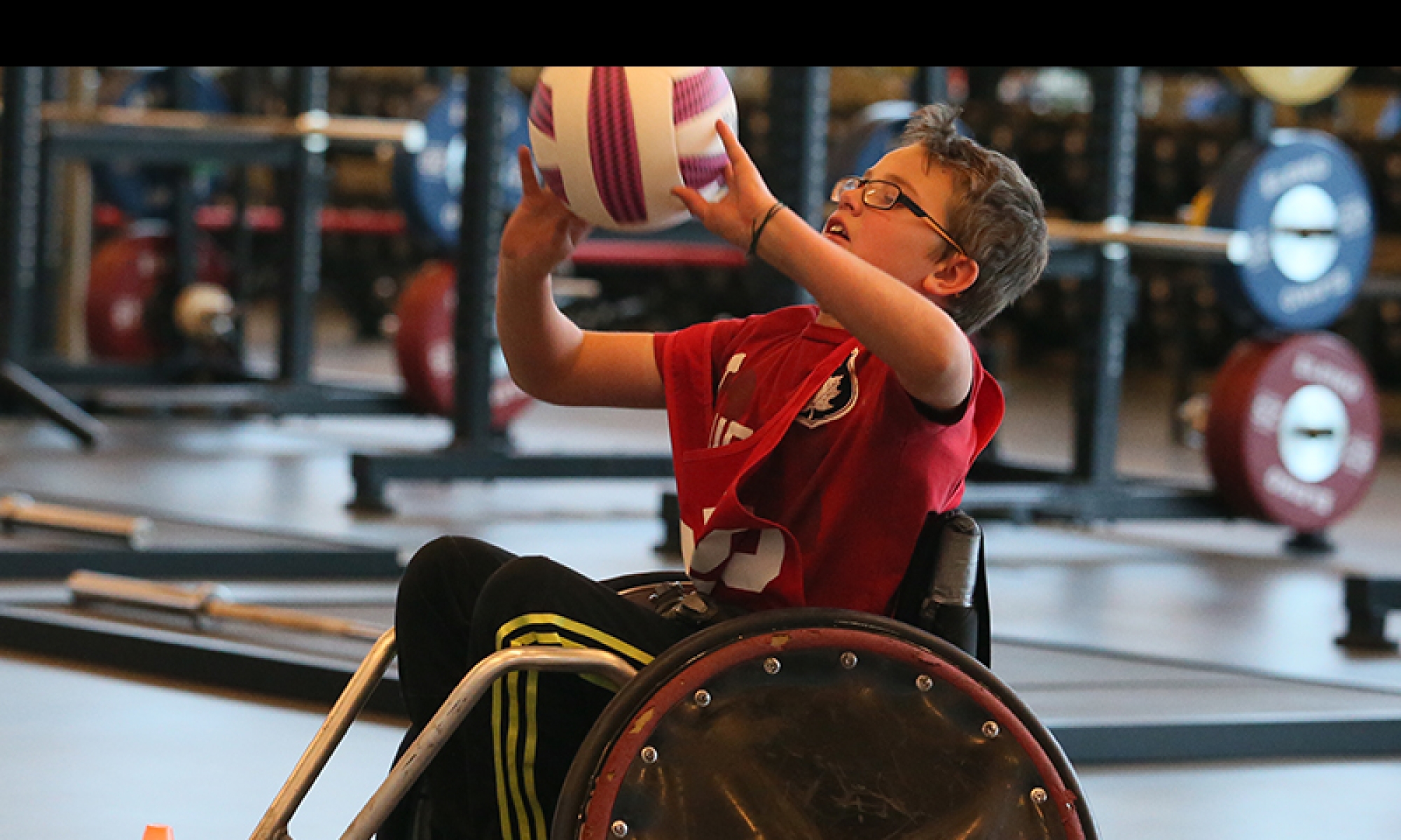 Athlete in a wheelchair throwing a ball