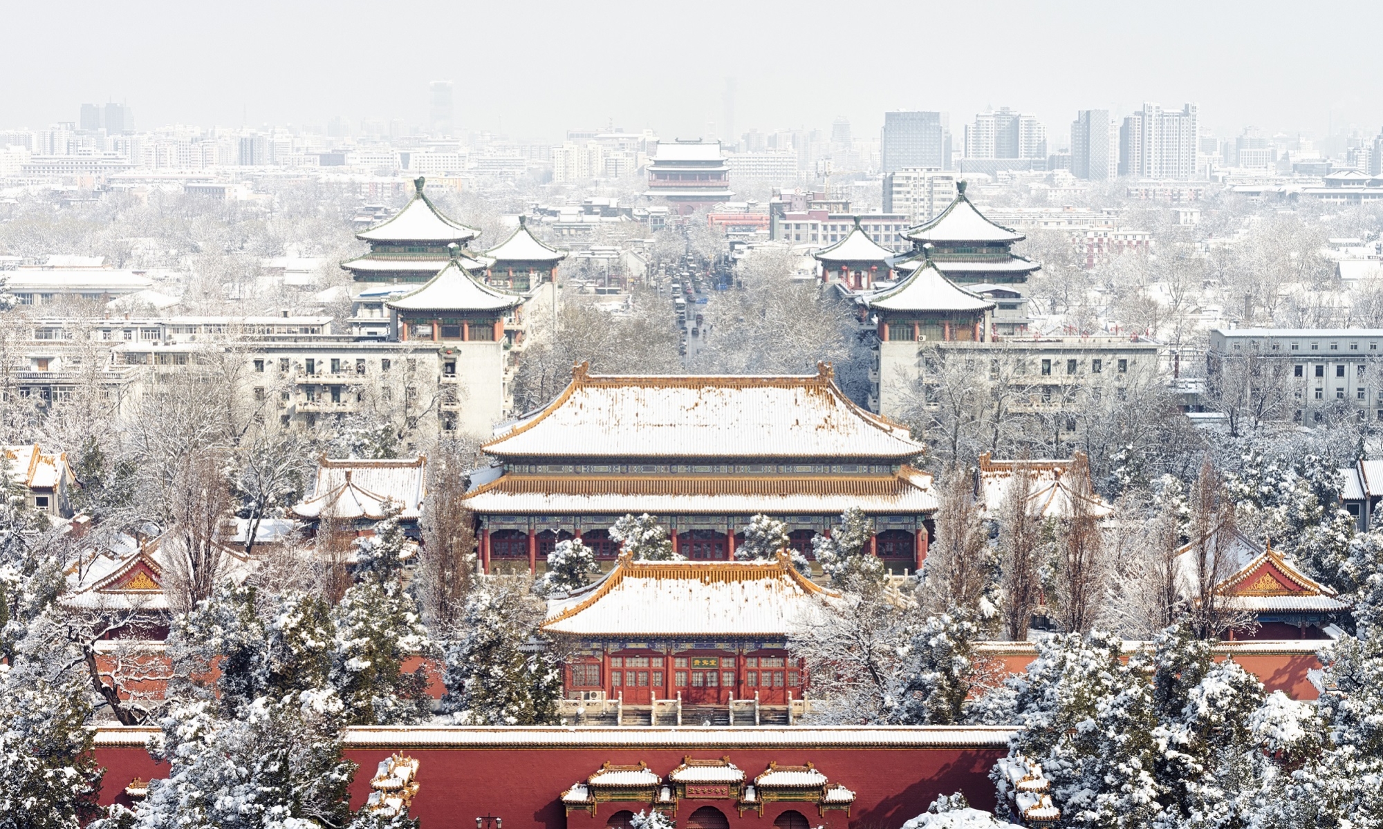 Building in China with snow falling in front 