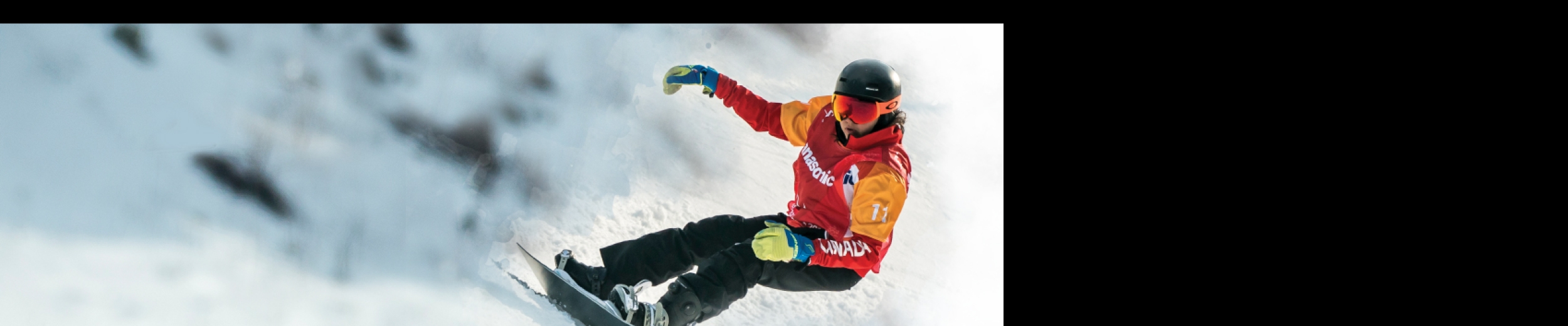 Sandrine Hamel snowboarding down a mountain 