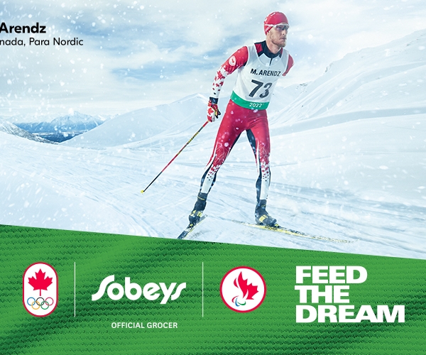Mark Arendz skiing with the Sobeys logo and feed the dream title