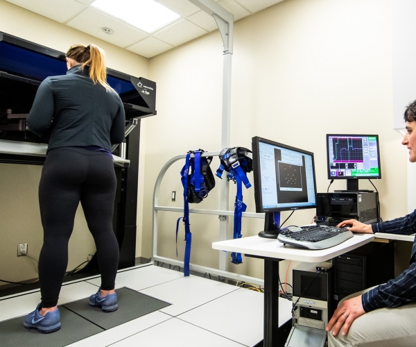 An athlete is tested on the KINARM robotic technology testing brain function.