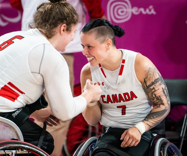 Cindy Ouellet and Arinn Young celebrate after winning the semifinals 