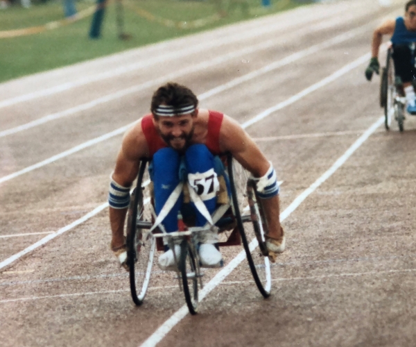 Paralympian Paul Clark competes in a wheelchair race. 