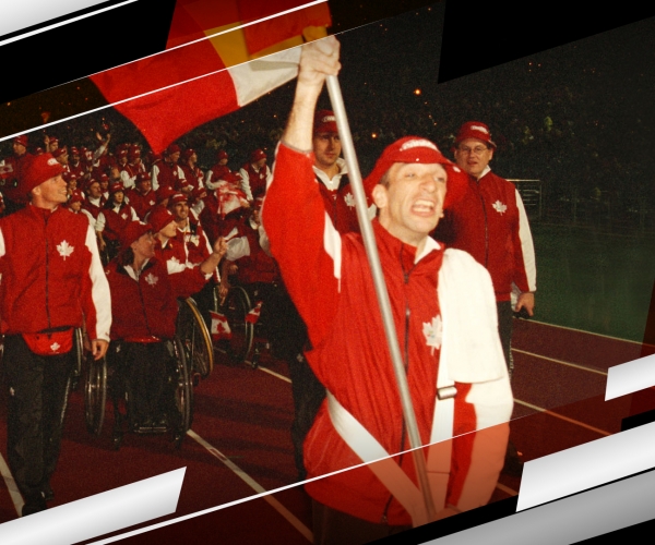Para cyclist Gary Longhi leads Canada into the Opening Ceremony at the Sydney 2000 Paralympic Games