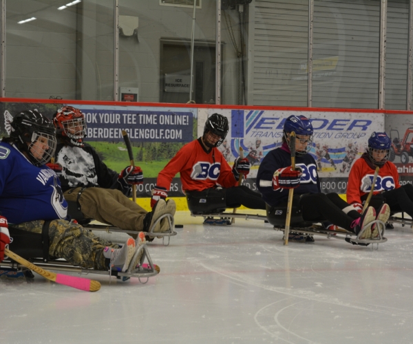 Northern Adapted Sports Association participants at a Para ice hockey session. 