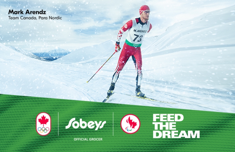 Mark Arenda, Para Nordic, skiing in the background with a powerful look. Logos of CPC Sobeys (Official grocer) and CPC below with bold text Feed The Dream
