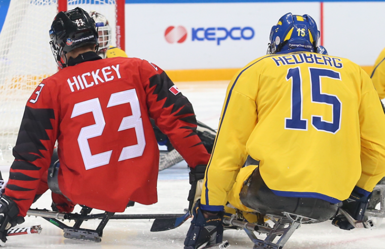 Liam Hickey shooting the puck against Sweden at the 2018 Paralympic Winter Games 