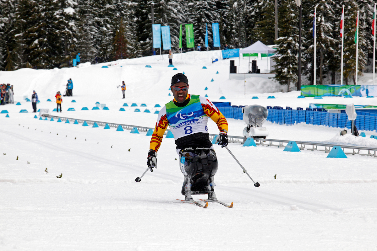 Lou Gibson racing in Para nordic sit skiing at the Vancouver 2010 Paralympic Winter Games