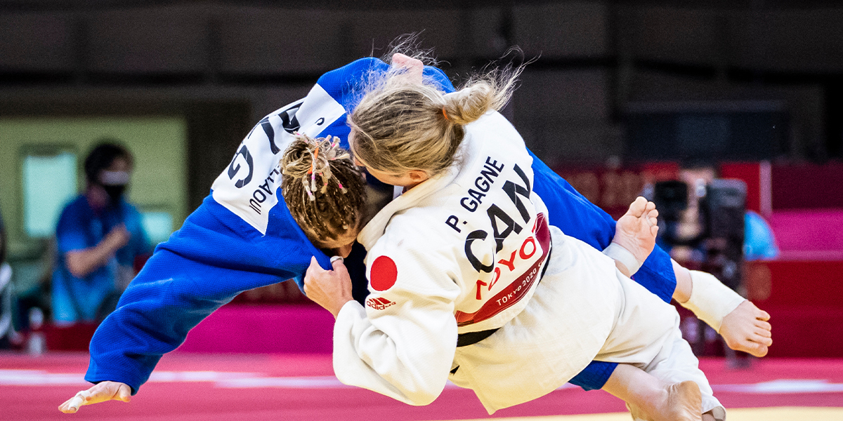 Canadian Para judoka Priscilla Gagné flips her opponent during a bout at the Tokyo 2020 Paralympics.