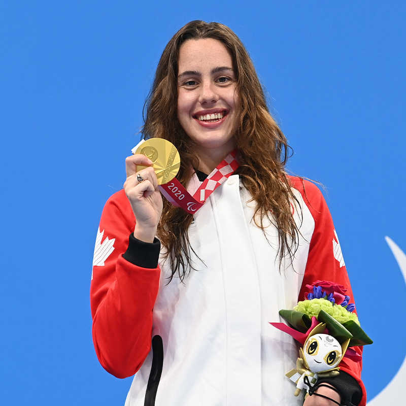 Canadian Para swimmer Aurélie Rivard celebrates with her gold medal at the Tokyo 2020 Paralympics.