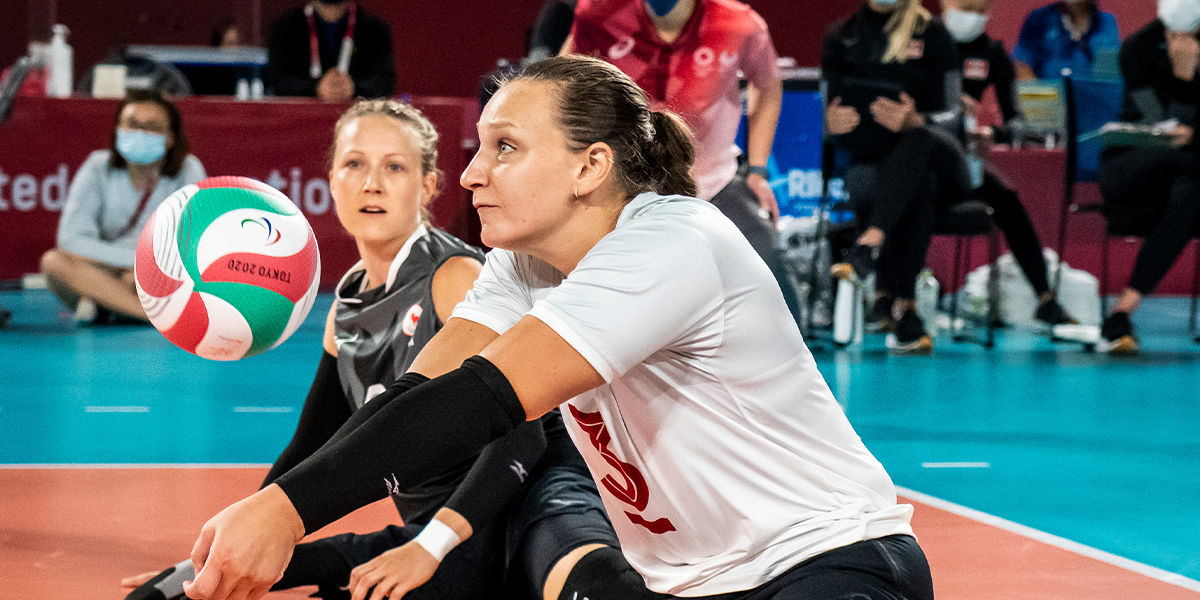 Canadian Sitting volleyball player Danielle Ellis digs a pass during a match at the Tokyo 2020 Paralympics.