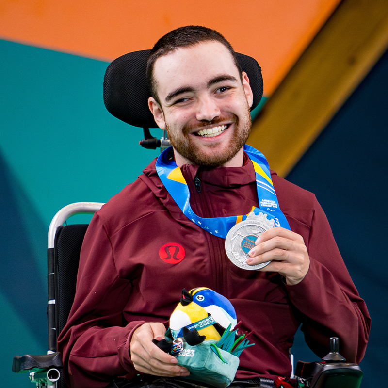 Canadian Boccia player Danik Allard poses with his Santiago 2023 Parapan American Games silver medal for Men's Individual BC2 event.