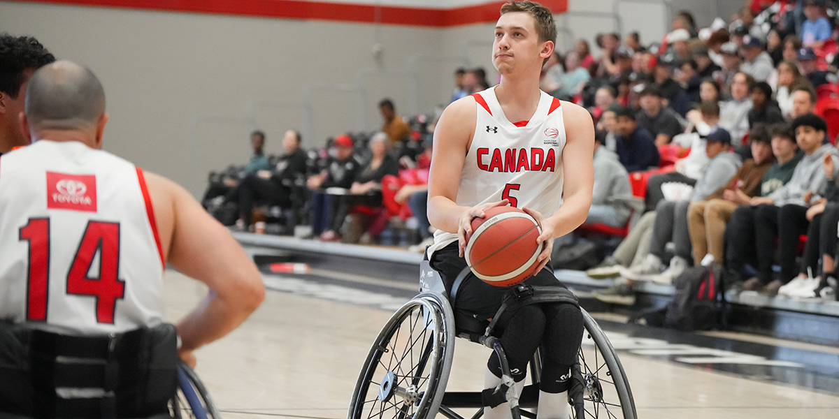 Canadian Wheelchair basketballer Reed De'Aeth readying himself to take a shot during a match.