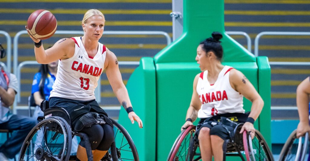 Kady Dandeneau and Tara Llanes in wheelchair basketball action at Santiago 2023