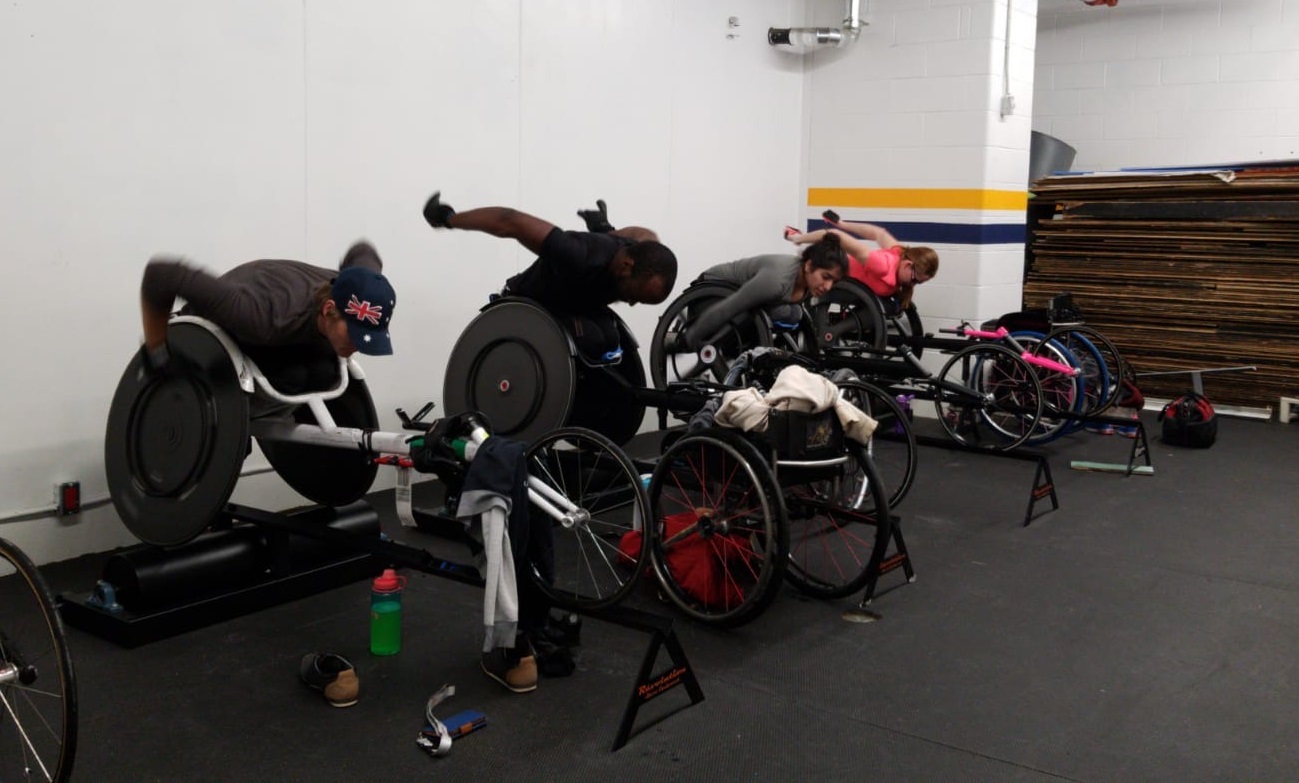 Cruisers Sports wheelchair racers in their chairs.