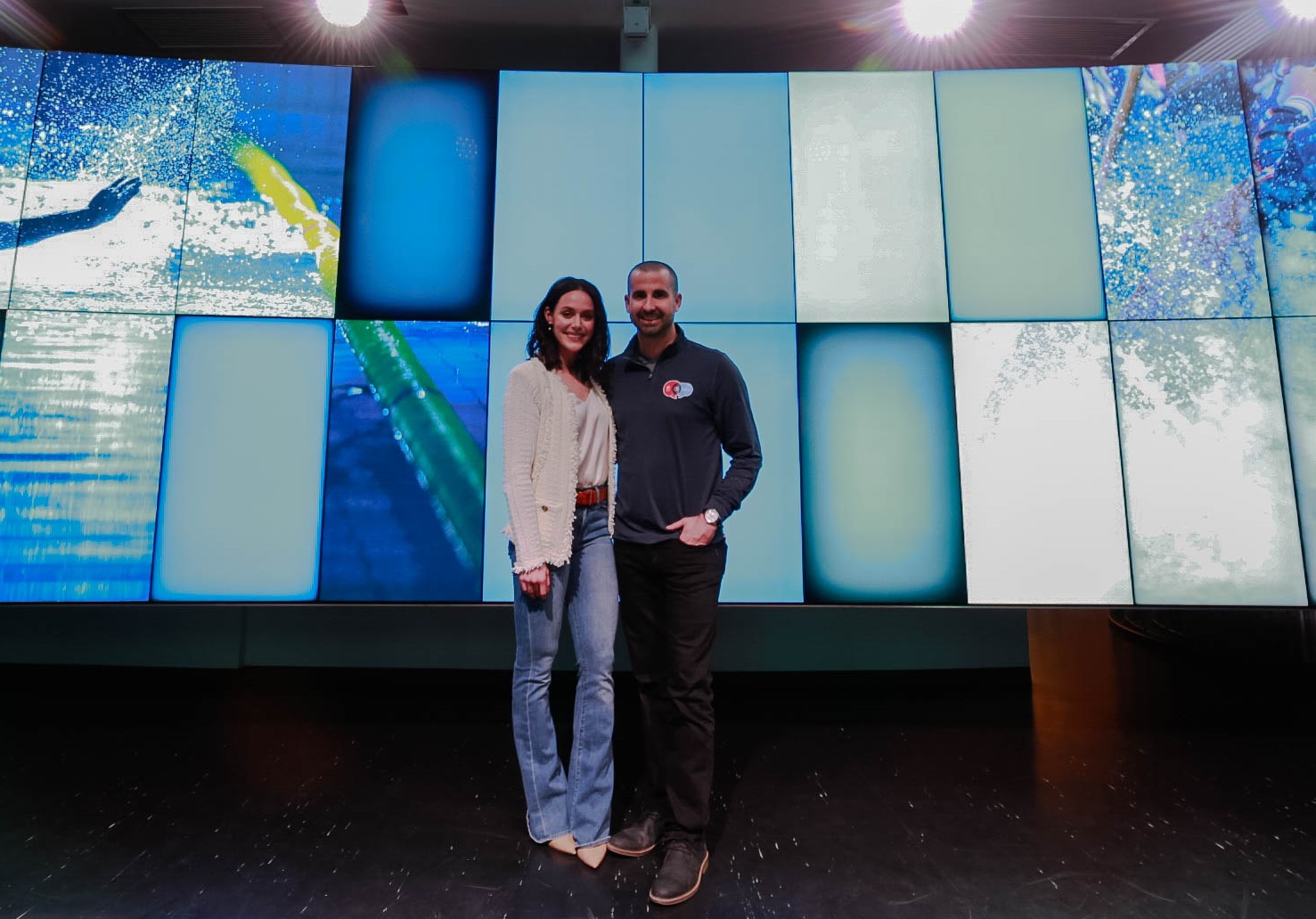 Tessa Virtue and Benoit Huot standing next to each other at a Team Canada Champion Chat event in February 2020