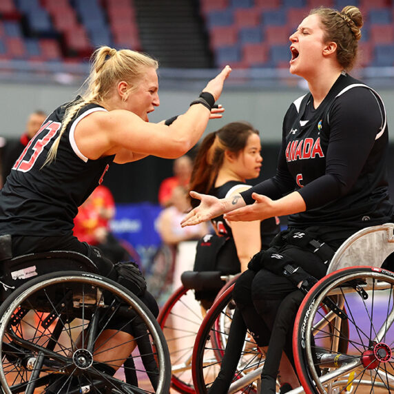 Kady Dandeneau and Arinn Young exchanging high fives during the game.