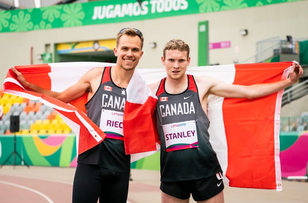 Nate Riech and Liam Stanley with the Canadian flag.