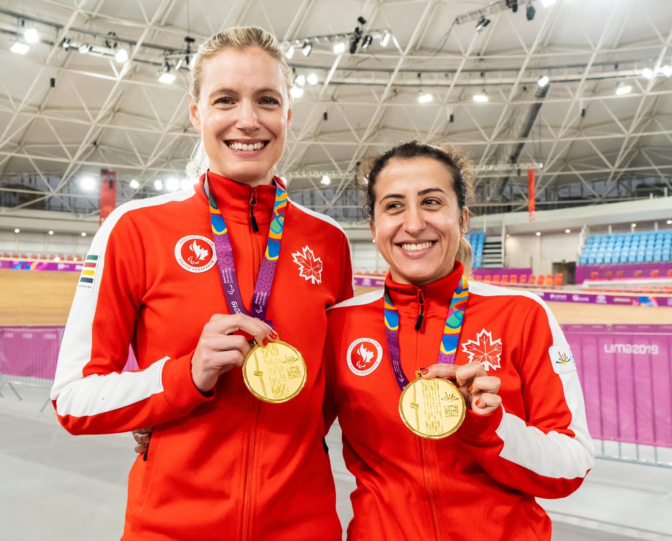 Carla Shibley (right) and her pilot Meghan Lemiski (left) with their gold medals.