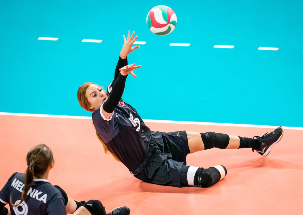 Payden Olsen volleys the ball in sitting volleyball action at the Lima 2019 Parapan Am Games