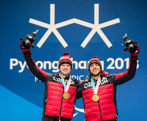 Mac Marcoux and his guide Jack Leitch collecting their gold medal in PyeongChang