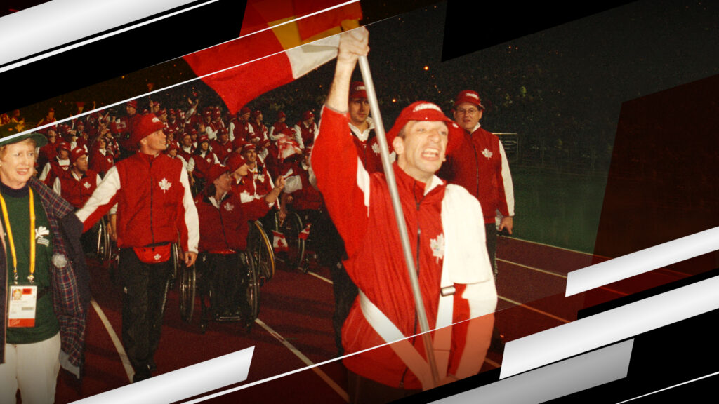 Para cyclist Gary Longhi leads Canada into the Opening Ceremony at the Sydney 2000 Paralympic Games