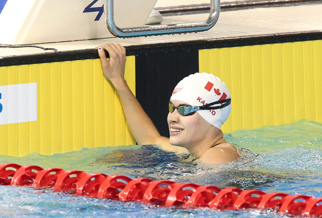 Kirstie Kasko smiling in the pool after a race.