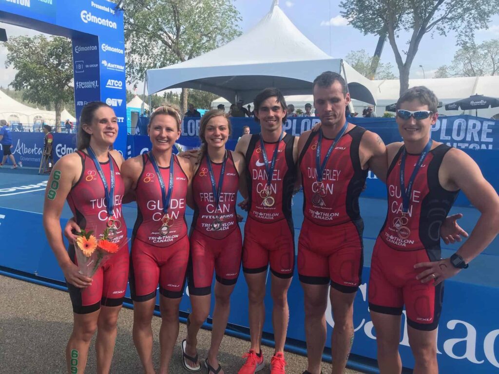 6 athletes in a group photo after Para triathlon