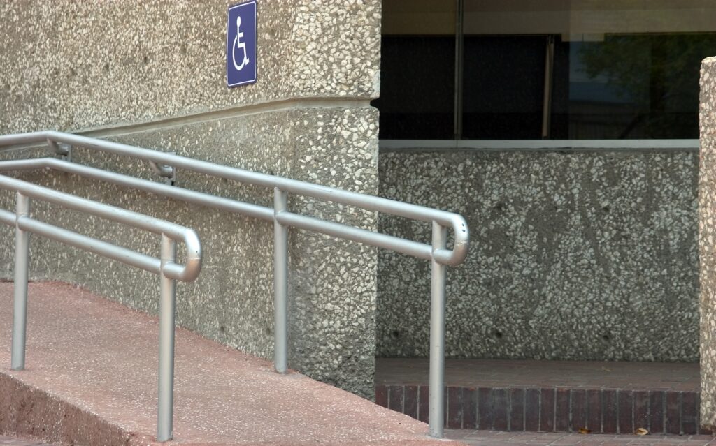 A photo of an accessible ramp outside a building