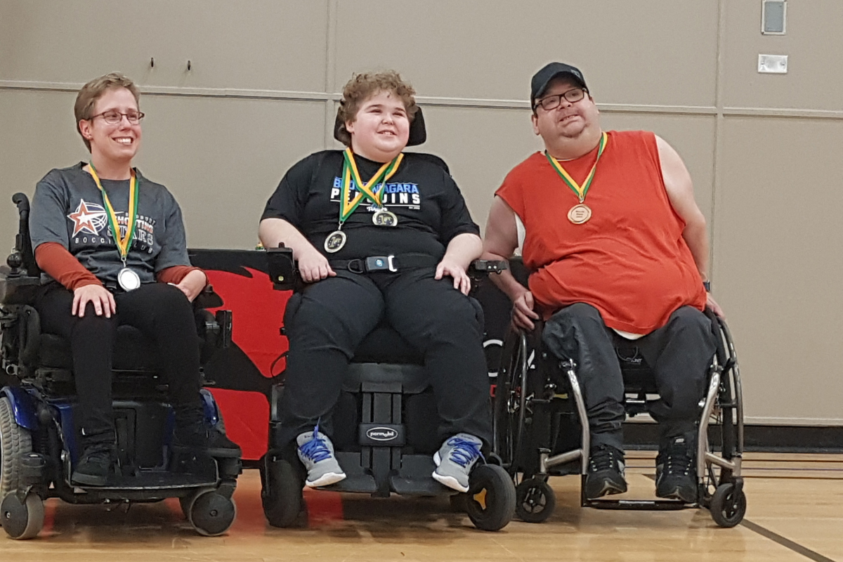Boccia Blast participants from a previous year wearing their medals following the tournament.
