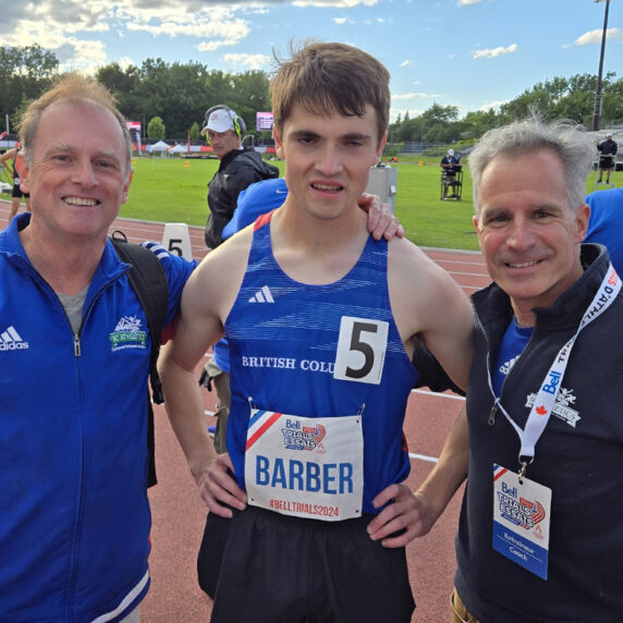 Canadian Para runner Michael Barber poses with family members following a race at the 2024 Athletics Canada Paralympic Trials.