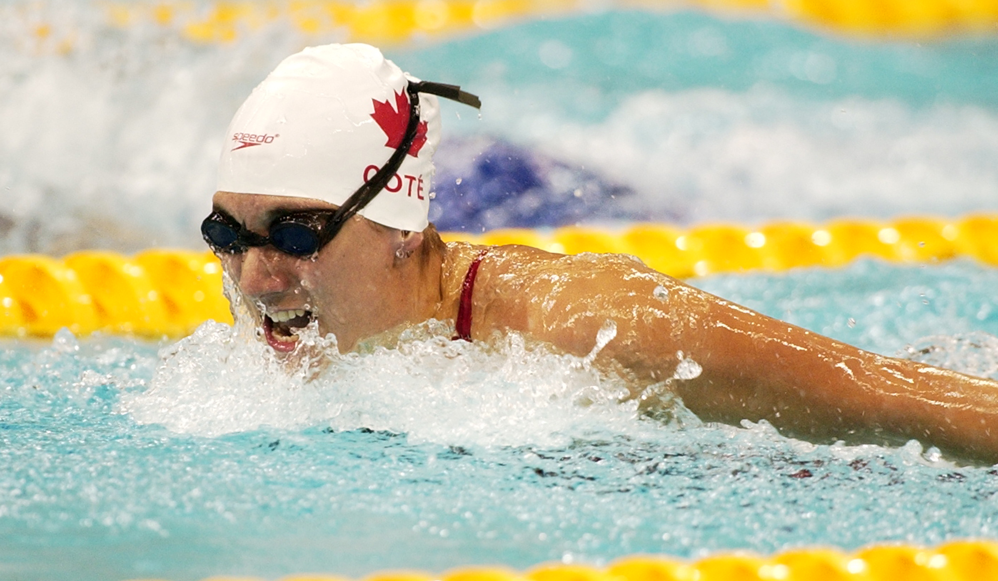 Kirby Cote swims to a gold medal in Para Swimming.