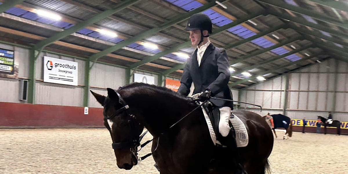 Canadian Para equestrian rider Austen Burns practicing a routine while riding his horse Happy Feet.