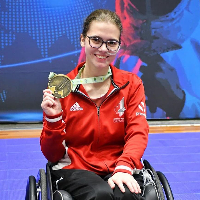 Canadian Wheelchair fencer Trinity Lowthian celebrates with her gold medal at the 2024 American Championships.