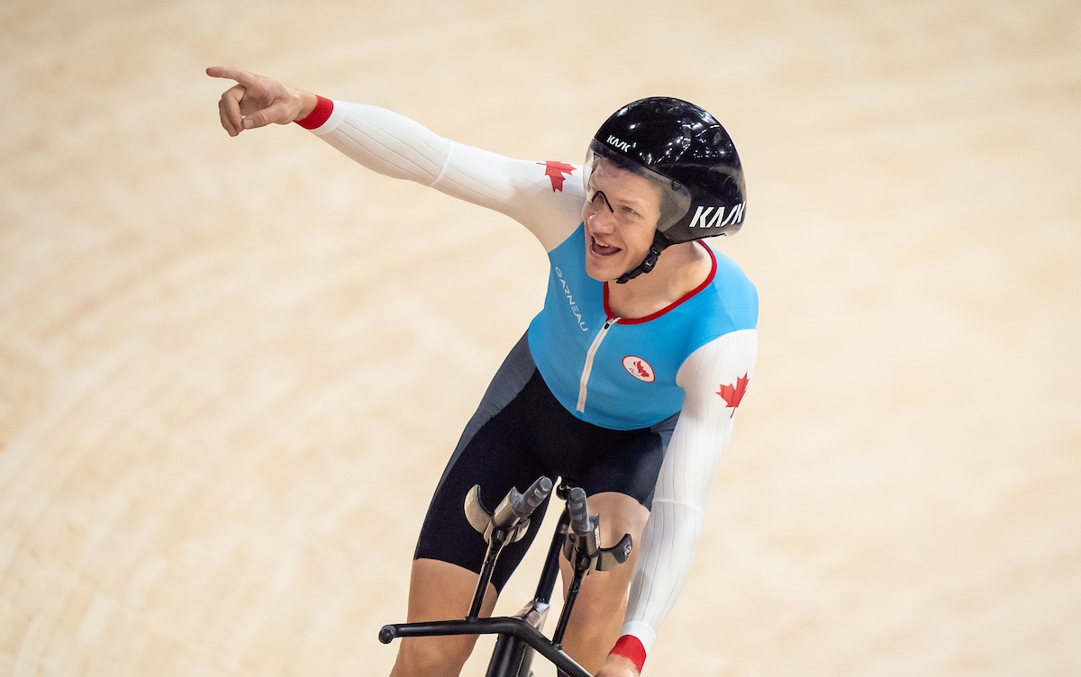 Alexandre Hayward celebrates following his bronze medal race